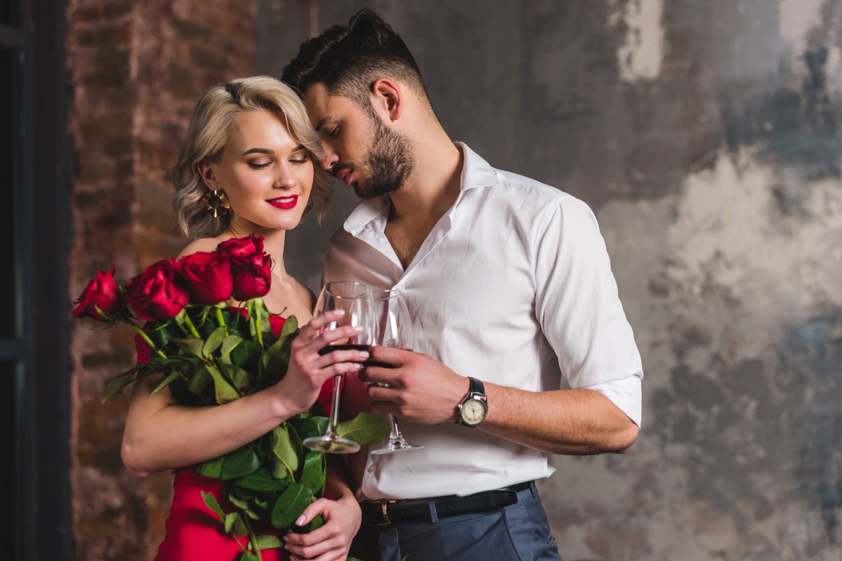 romantic couple with wine and roses
