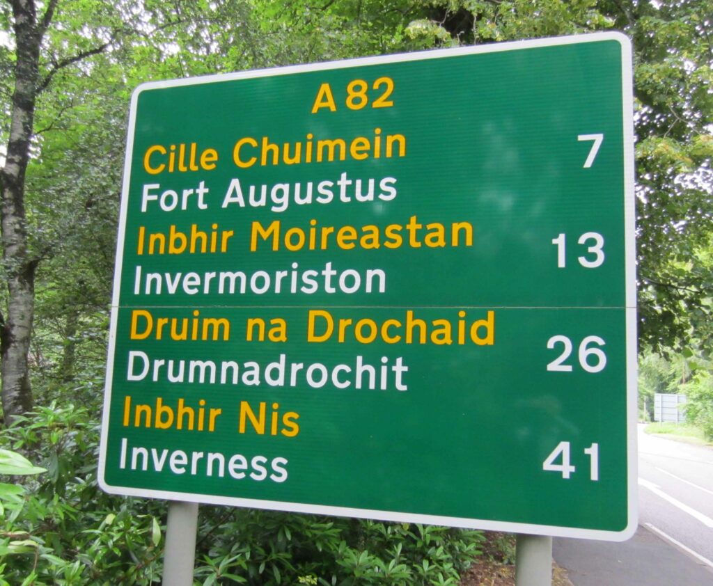 road sign with gaelic on it