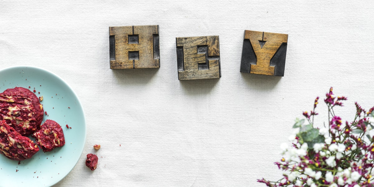 the word hey engraved on wooden blocks