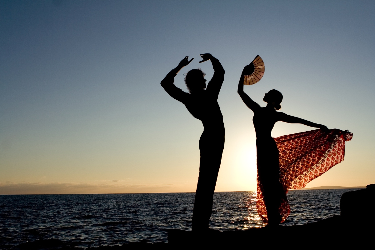 spanish dancers doing flamenco in sunset